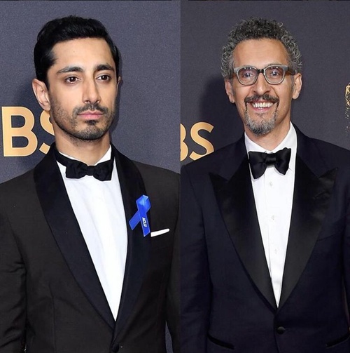 Riz Ahmed in Prada and wearing an ACLU ribbon alongside NightOf costar JohnTurturro