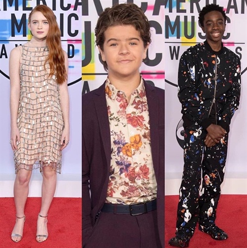 Stranger Things stars SadieSink (in Prada), Gaten Matarazzo and Caleb McLaughlin hit the red carpet at the AMAs