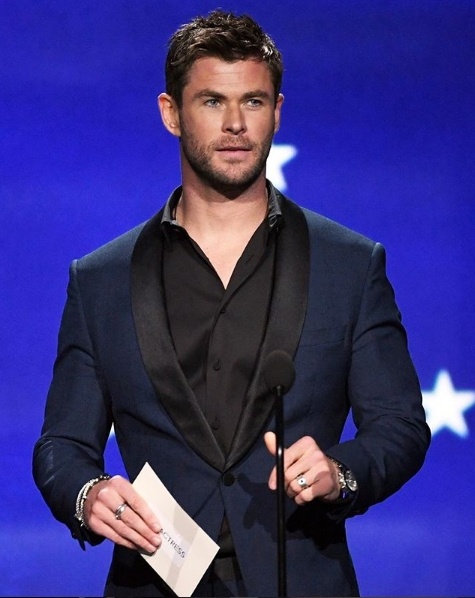 Chris Hemsworth presents on stage at the Critics Choice Awards