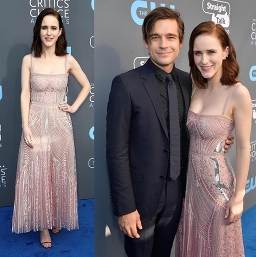 Rachel Brosnahan in Zuhair Murad keeps close to partner Jason Ralph on the blue carpet while promoting The Marvelous Mrs Maisel