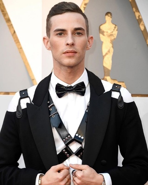 Olympic medalist Adam Rippon in a Moschino by Jeremy Scott harness